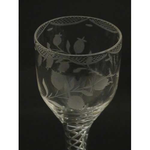 244 - Ten Georgian drinking glasses with air twist detail to stems, the bowls engraved with floral and fol... 