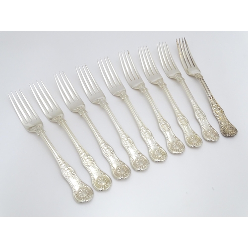 525 - Nine associated Victorian silver Kings pattern dessert forks comprising eight hallmarked London 1865... 