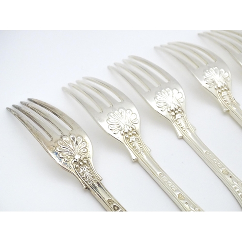 525 - Nine associated Victorian silver Kings pattern dessert forks comprising eight hallmarked London 1865... 