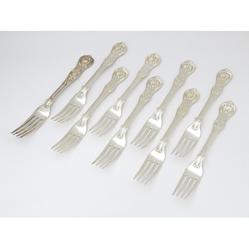 525 - Nine associated Victorian silver Kings pattern dessert forks comprising eight hallmarked London 1865... 