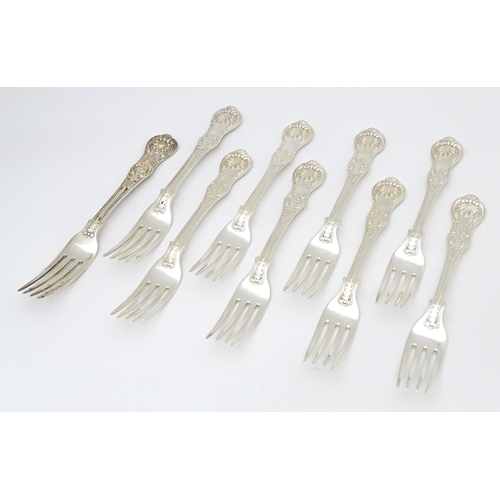 525 - Nine associated Victorian silver Kings pattern dessert forks comprising eight hallmarked London 1865... 