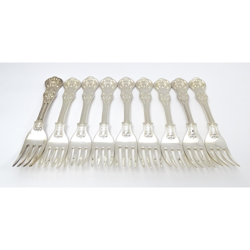 525 - Nine associated Victorian silver Kings pattern dessert forks comprising eight hallmarked London 1865... 