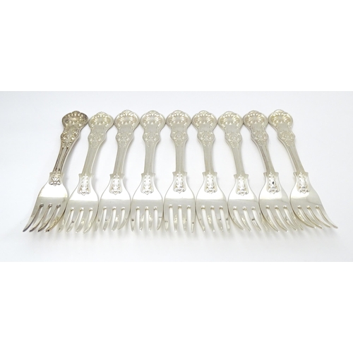 525 - Nine associated Victorian silver Kings pattern dessert forks comprising eight hallmarked London 1865... 