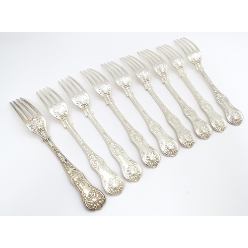 525 - Nine associated Victorian silver Kings pattern dessert forks comprising eight hallmarked London 1865... 