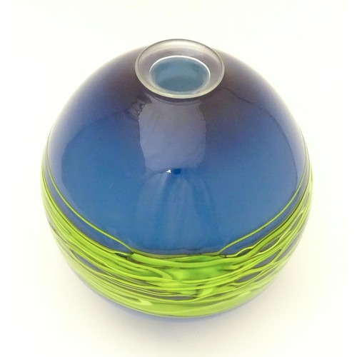 187 - An art / studio glass vase by Bob Crooks of globular form trailed with green banding over a blue gro... 