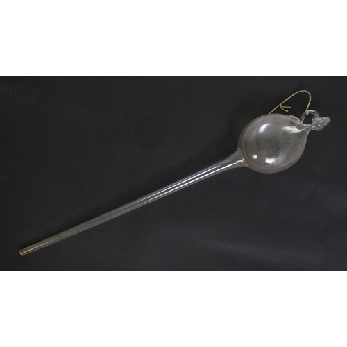 1081 - A 19thC hand blown glass wine thief, wine testing / sampling implement. Approx. 34