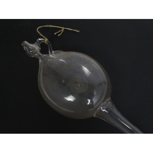 1081 - A 19thC hand blown glass wine thief, wine testing / sampling implement. Approx. 34