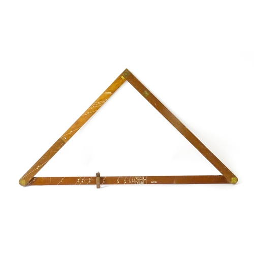 1150 - An M.D.S. Ltd. surveyor's folding triangle rule with inset spirit level and plumb bob. No. B.49645. ... 