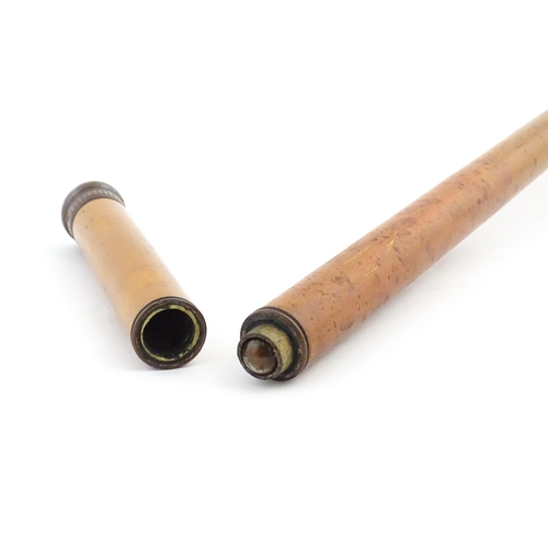 1252 - An early 20thC boxwood walking cane, the removable handle with provision for glass vial. Approx. 35 ... 