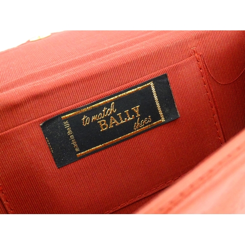 1267 - Vintage fashion: Five vintage bags comprising a red leather, envelope style, 'to match Bally style' ... 