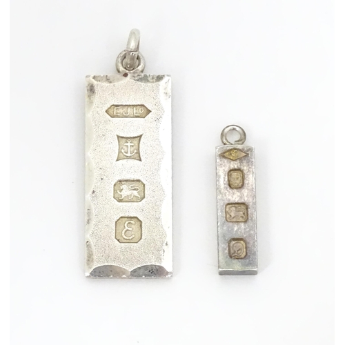 677 - Two silver pendants of ingot form, one hallmarked Birmingham 1979, the other hallmarked London 1978.... 