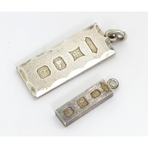 677 - Two silver pendants of ingot form, one hallmarked Birmingham 1979, the other hallmarked London 1978.... 