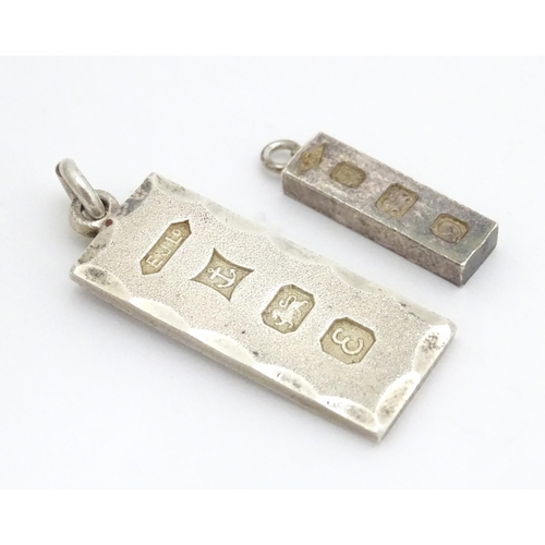 677 - Two silver pendants of ingot form, one hallmarked Birmingham 1979, the other hallmarked London 1978.... 