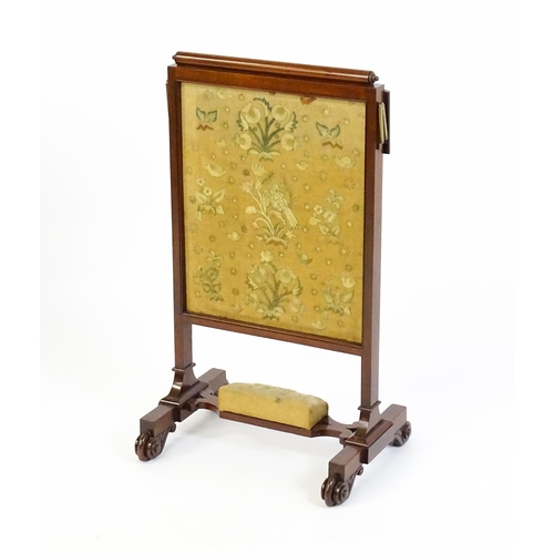 1390 - A late 19thC mahogany fire screen with a hinged shelf attatched to the top of the frame, the central... 