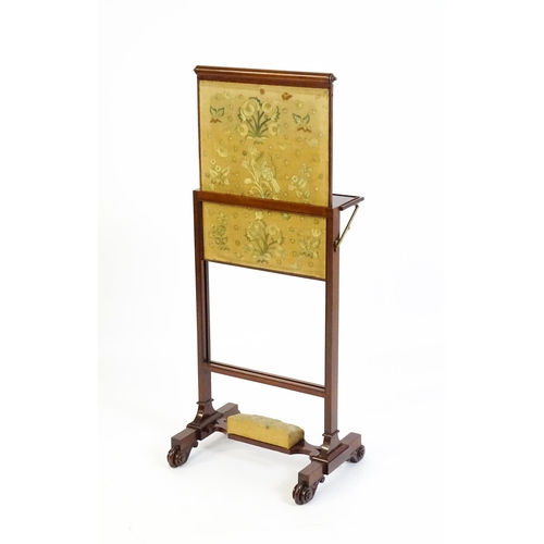 1390 - A late 19thC mahogany fire screen with a hinged shelf attatched to the top of the frame, the central... 