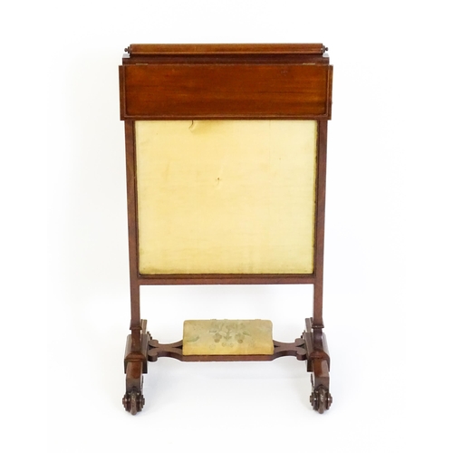 1390 - A late 19thC mahogany fire screen with a hinged shelf attatched to the top of the frame, the central... 