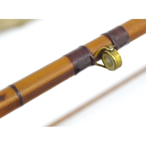 1218 - An early 20thC three-piece 10ft fly fishing rod by Hardy Bros , Alnwick , constructed from whole can... 