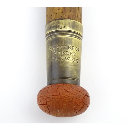 1218 - An early 20thC three-piece 10ft fly fishing rod by Hardy Bros , Alnwick , constructed from whole can... 