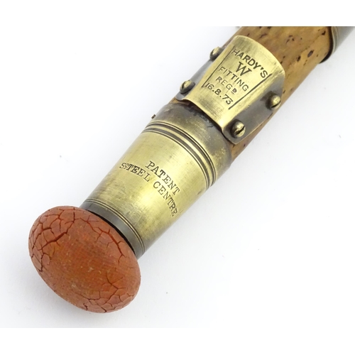 1218 - An early 20thC three-piece 10ft fly fishing rod by Hardy Bros , Alnwick , constructed from whole can... 