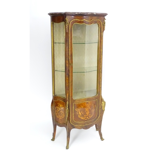 1389 - An early 20thC marbled topped kingwood cabinet with gilt metal mounts and brackets, the kingwood fra... 