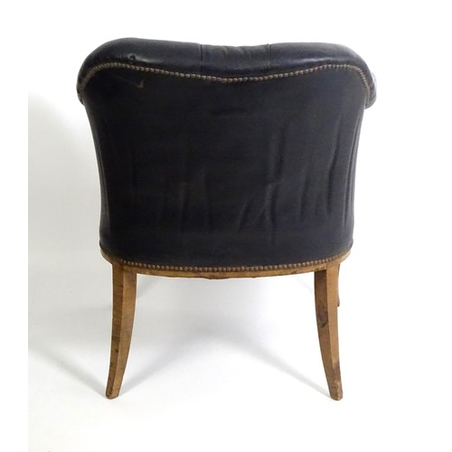 1405 - A mid 20thC deep buttoned leather armchair, raised on cabriole front legs and tapering back legs. 30... 