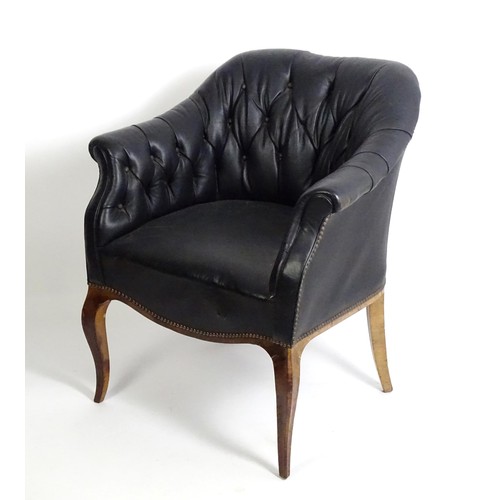 1405 - A mid 20thC deep buttoned leather armchair, raised on cabriole front legs and tapering back legs. 30... 