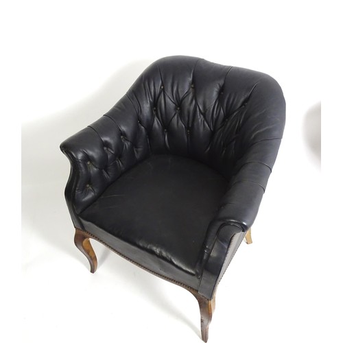 1405 - A mid 20thC deep buttoned leather armchair, raised on cabriole front legs and tapering back legs. 30... 