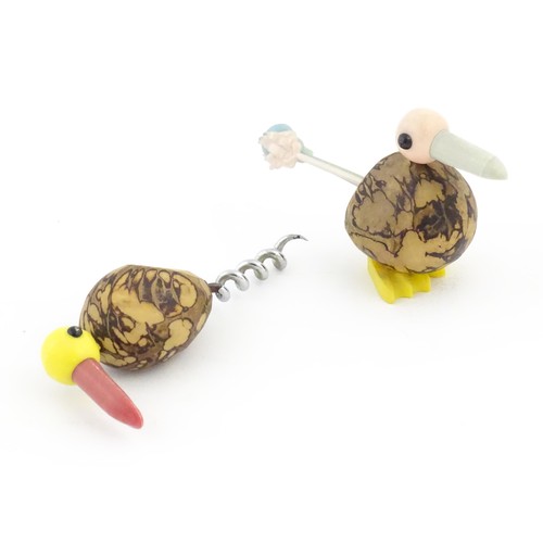 1086 - A 20thC novelty corkscrew and novelty cocktail stick holder each modelled as stylised parrots / bird... 