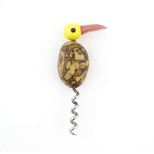 1086 - A 20thC novelty corkscrew and novelty cocktail stick holder each modelled as stylised parrots / bird... 