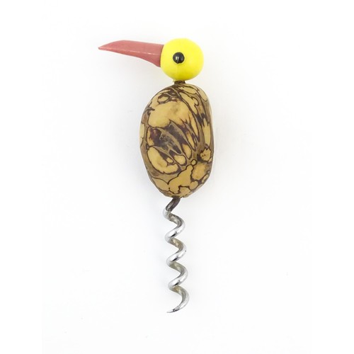 1086 - A 20thC novelty corkscrew and novelty cocktail stick holder each modelled as stylised parrots / bird... 