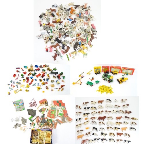 857 - Toys: A quantity of assorted Britains farmyard die cast and plastic toys / models to include tractor... 