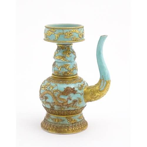 24 - A Chinese wine ewer with funnel cover, the turquoise ground decorated with gilt dragons and bats amo... 