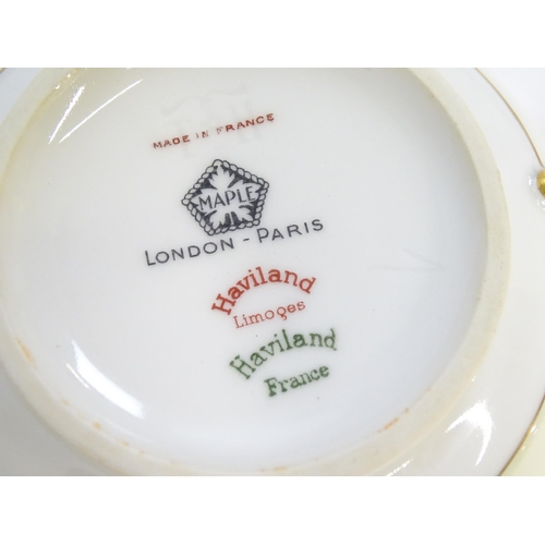 219 - A quantity of Haviland Limoges dinner wares with banded foliate border, to include plates, serving p... 