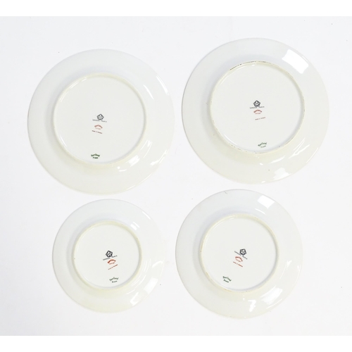 219 - A quantity of Haviland Limoges dinner wares with banded foliate border, to include plates, serving p... 