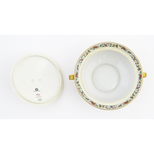 219 - A quantity of Haviland Limoges dinner wares with banded foliate border, to include plates, serving p... 