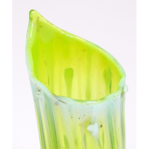 234 - Three items of art glass to include a bud vase and two other vases, one of uranium glass in the mann... 