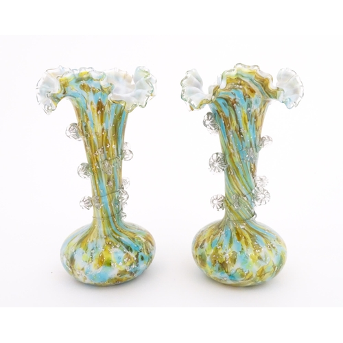 246 - A pair of art glass vases with flared rims and prunt detail. Approx 9 1/2