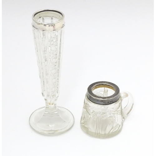 452 - A cut glass bud vase with silver rim hallmarked Birmingham 1901 together with a cut glass noggin wit... 