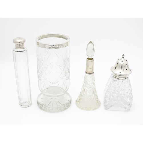 539 - Assorted cut glass items with silver mounts, to include a caster hallmarked 1939, a vase hallmarked ... 