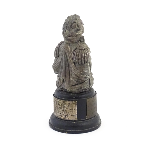 1040 - An early 20thC commemorative model of the figurehead of HMS Hastings, on a turned wooden base with t... 