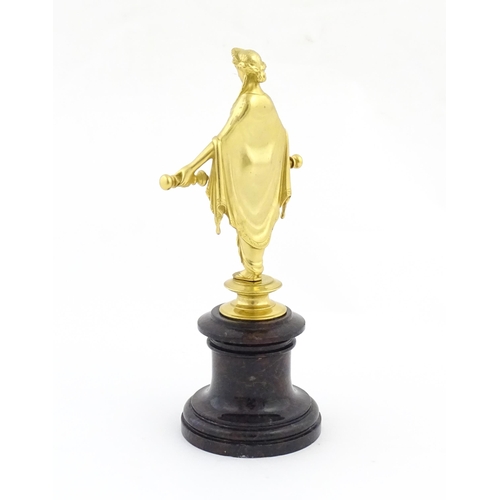 1042 - A late 19th / early 20thC Continental gilt bronze sculpture depicting an allegorical figure, possibl... 