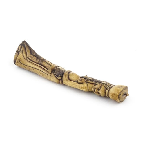 1125 - Ethnographic / Native / Tribal : An African carved bone with figural detail. Approx. 9 3/4