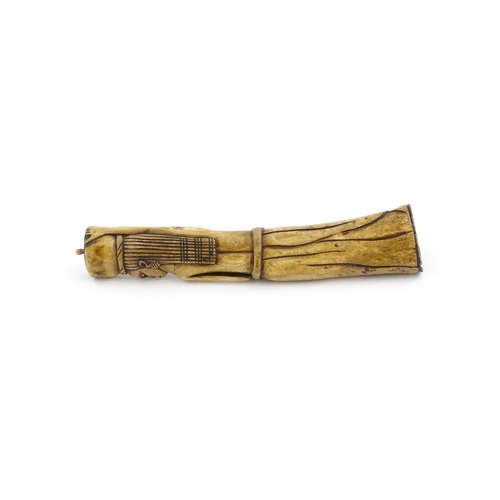 1125 - Ethnographic / Native / Tribal : An African carved bone with figural detail. Approx. 9 3/4