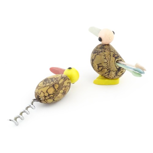 1133 - A 20thC novelty corkscrew and novelty cocktail stick holder each modelled as stylised parrots / bird... 