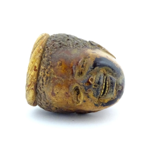 1175 - A 19thC carved meerschaum pipe the bowl depicting a smiling boy. Within a fitted case with retailers... 