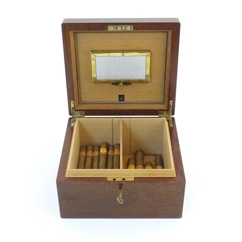 1178 - A 20thC mahogany Dunhill cedar lined humidor with two sections within. Together with a quantity of c... 