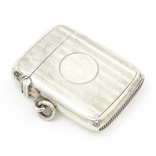 300 - A silver vesta case with engine turned decoration, hallmarked Birmingham 1907, maker William Hutton ... 