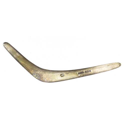 303 - A silver model of a boomerang, hallmarked London 1911, maker Asprey & Co. Ltd. Approx. 7