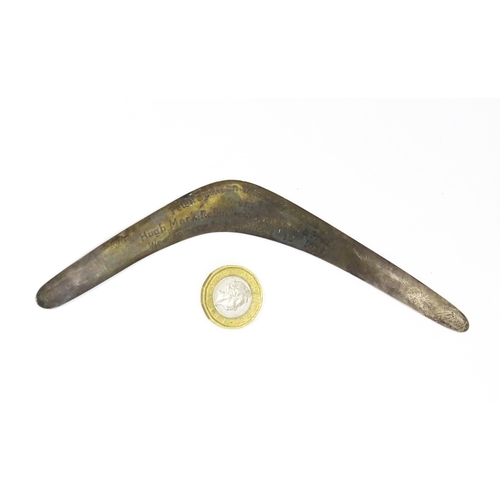 303 - A silver model of a boomerang, hallmarked London 1911, maker Asprey & Co. Ltd. Approx. 7