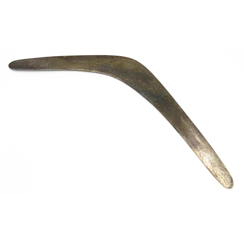 303 - A silver model of a boomerang, hallmarked London 1911, maker Asprey & Co. Ltd. Approx. 7